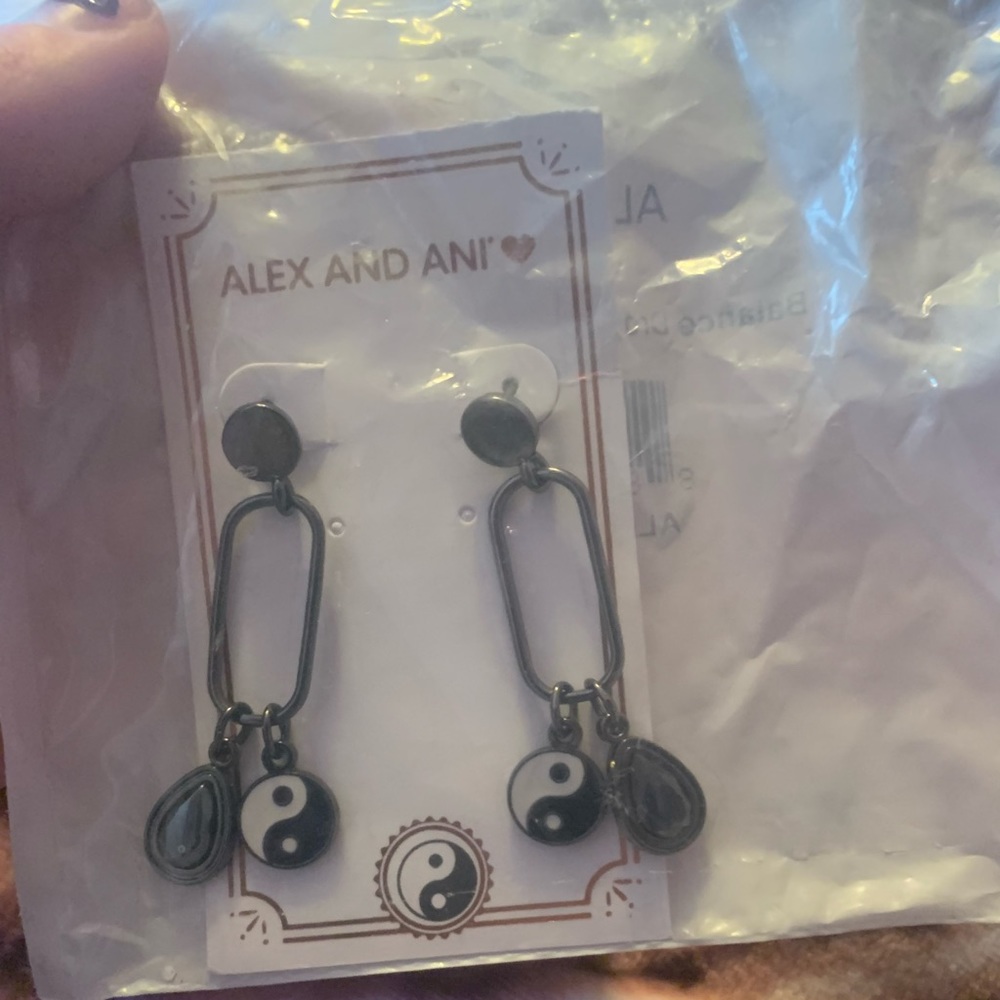 Never opened Alex and ani dangling yin Yang earrings got as a gift never opened